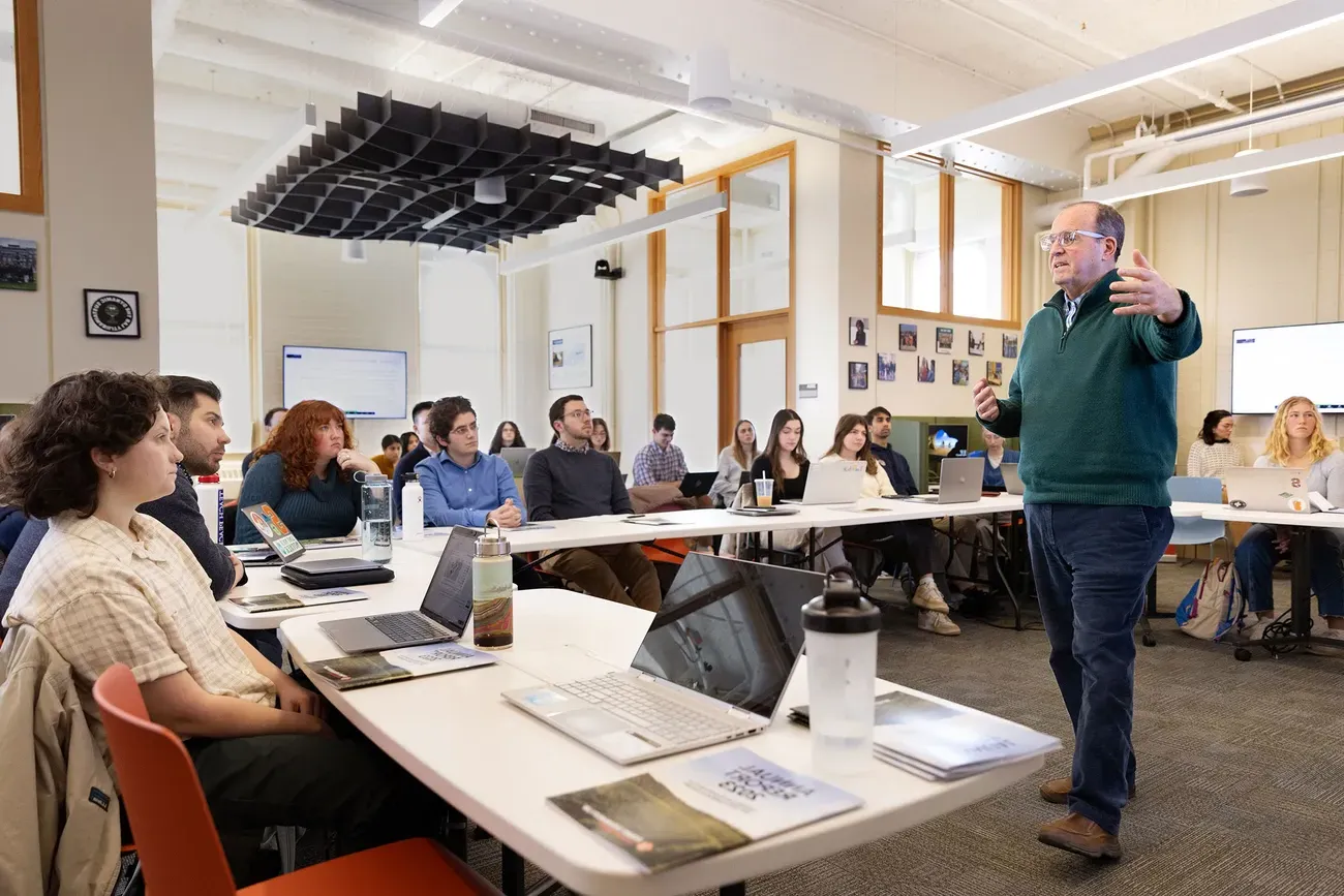 Professor Jay Golden teaching students in a classroom.